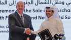 QatarEnergy CEO and Energy Minister Saad Sherida al-Kaabi pictured with ConocoPhillips CEO Ryan Lance upon signing the 15-year LNG deal. | Photo: KARIM JAAFAR/AFP / AFP