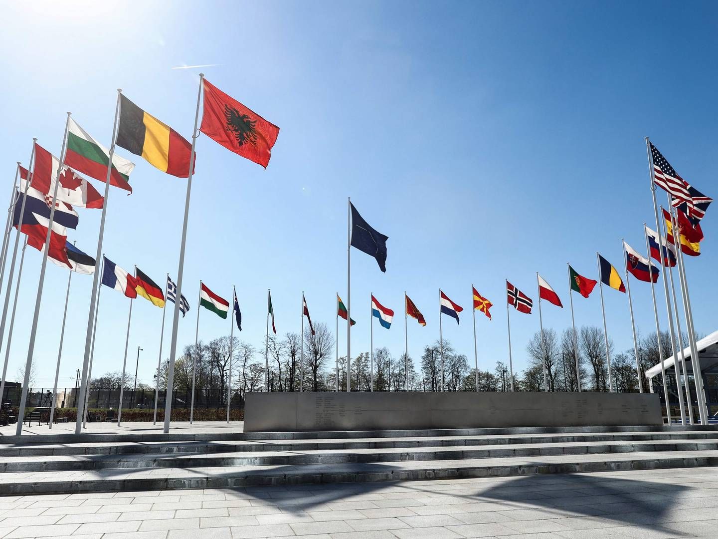 National flags of member countries in NATO flying outside organization headquarters in Brussels. On Tuesday around 15:45 CET, the Finnish flag will be raised among them | Photo: Kenzo Tribouillard/AFP/Ritzau Scanpix