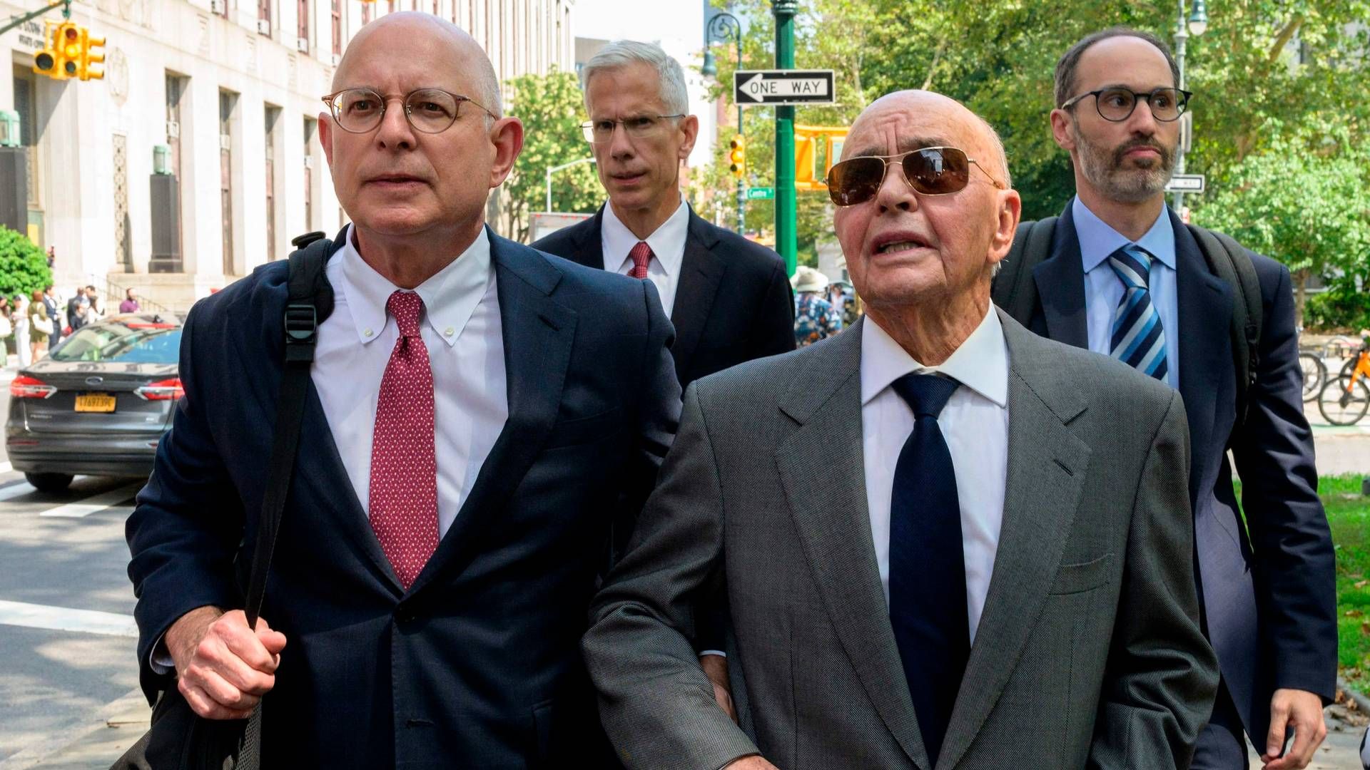 Joe Lewis (right) pleads not guilty to insider trading charges. | Photo: Angela Weiss