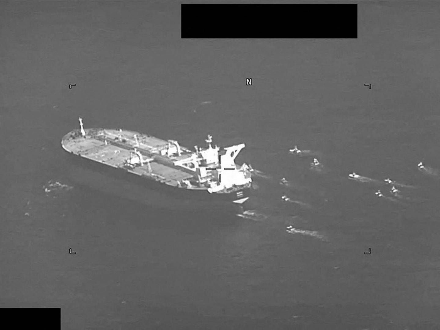 Archival picture of a tanker in Iranian waters being swarmed by crafts from Iran's Islamic Revolutionary Guard in the Strat of Hormuz. May 3, 2023. | Photo: U.s.naval Forces Central Command/Reuters/Ritzau Scanpix