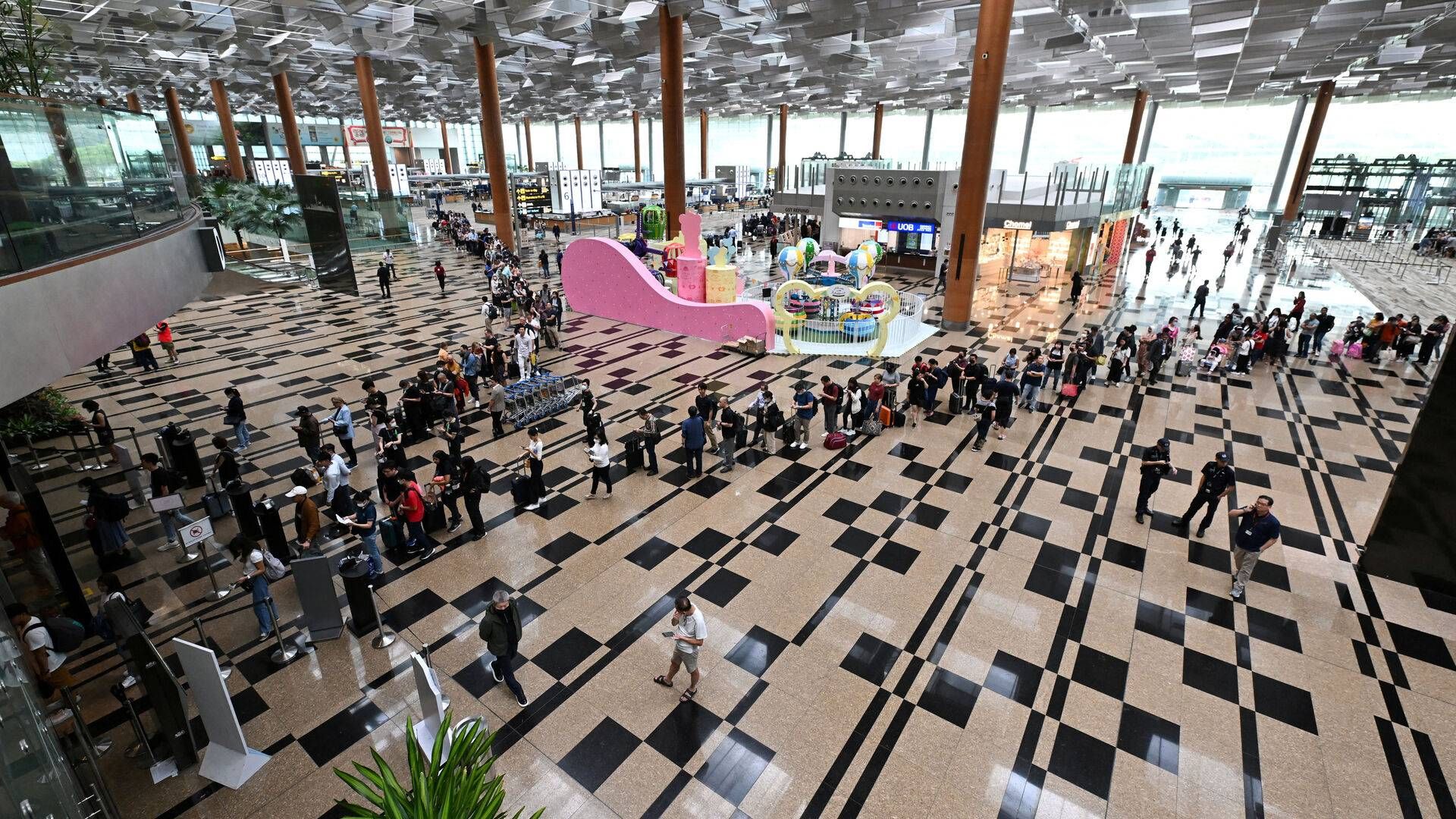 Ændringen sker, for at passagerer frem over kan slippe for at vise rejsedokumenter adskillelige gange, lyder det. | Foto: The Straits Times/Reuters/Ritzau Scanpix