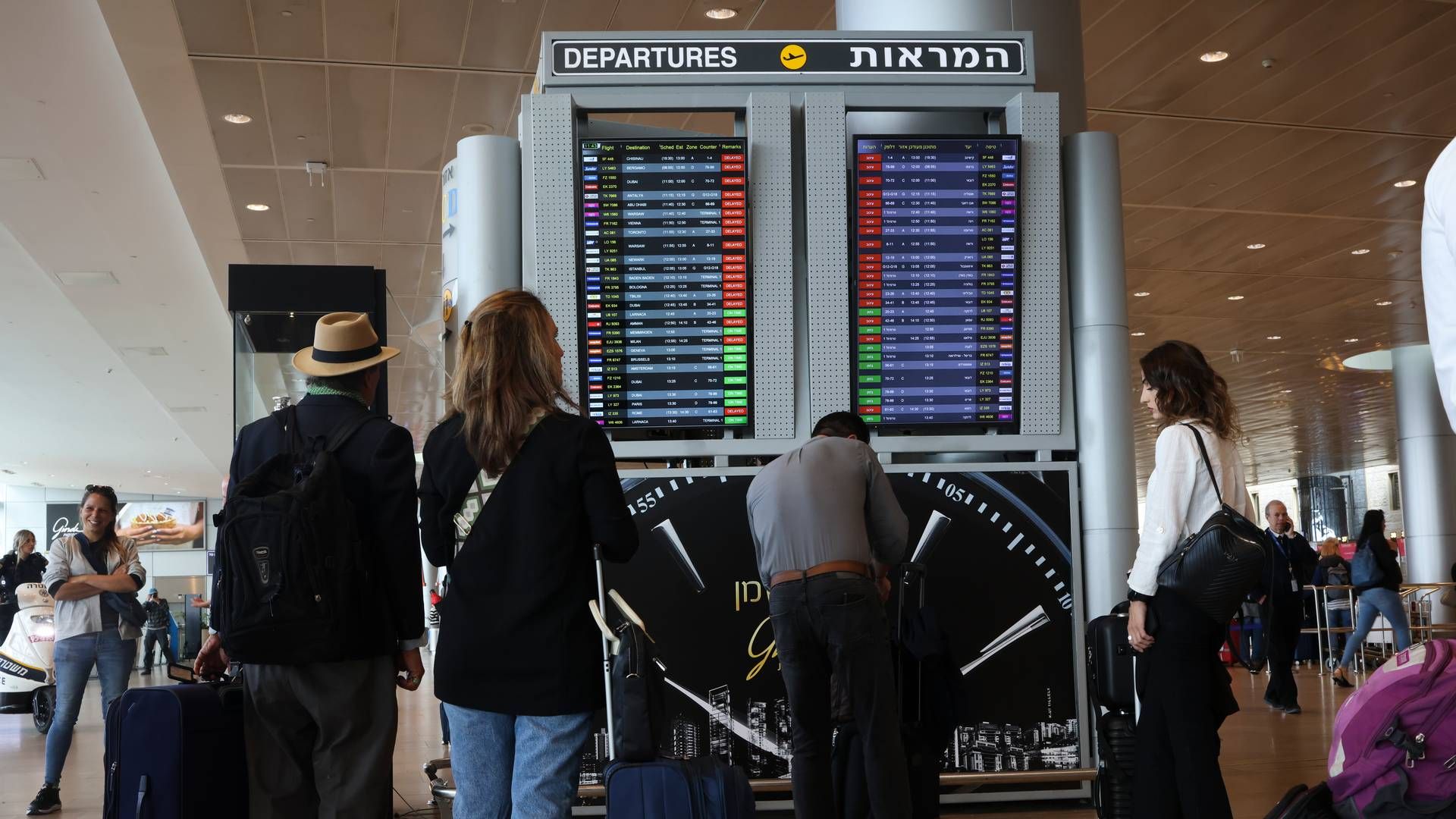 Illustrasjonsbilde. Reisende ved Ben Gurion lufthavn utenfor Tel Aviv. Tryg har foreløpig fått henvendelser fra 13 reisende som ønsker tidlig hjemreise fra Israel. | Foto: NTB