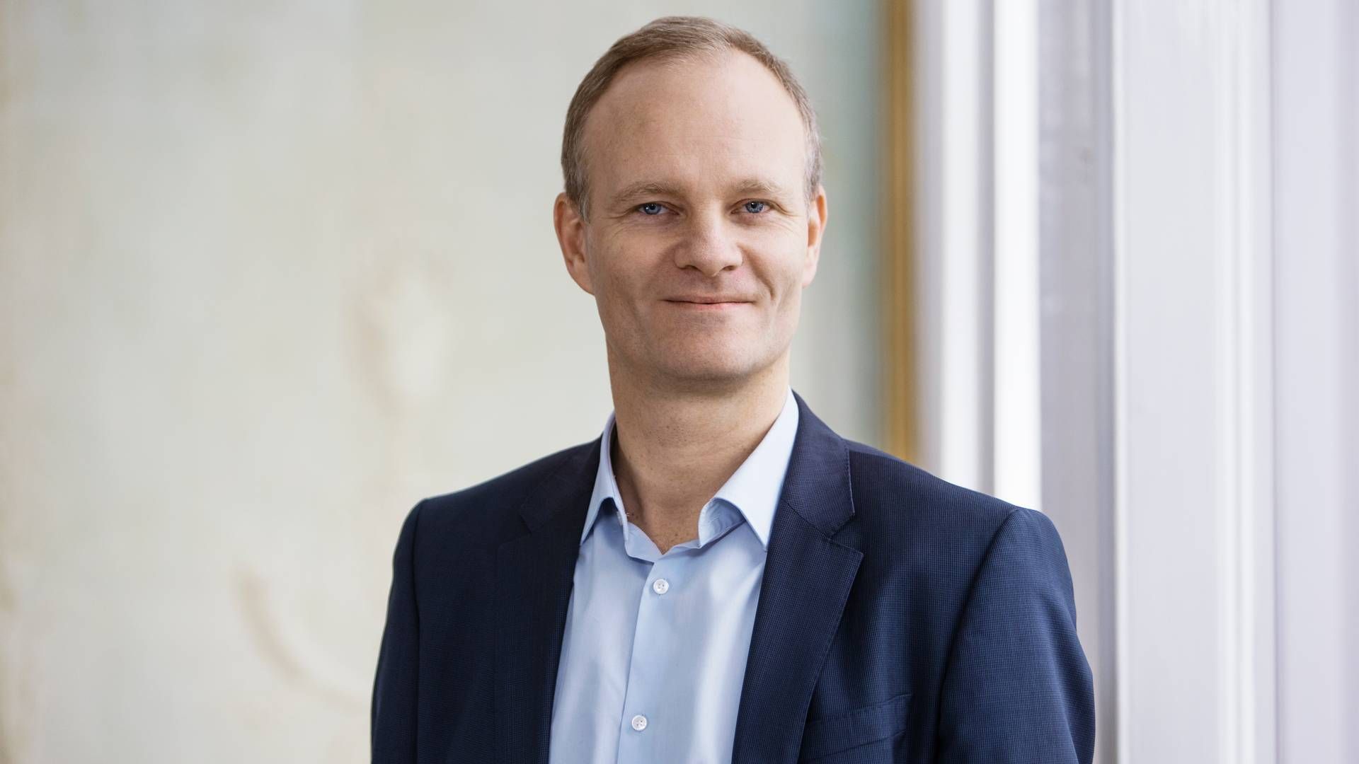 Christian Schmidt-Jacobsen, ledende partner i kapitalfonden Axcel, fortæller, at der er "lavere puls" på det danske marked for virksomhedshandler. | Foto: Pr