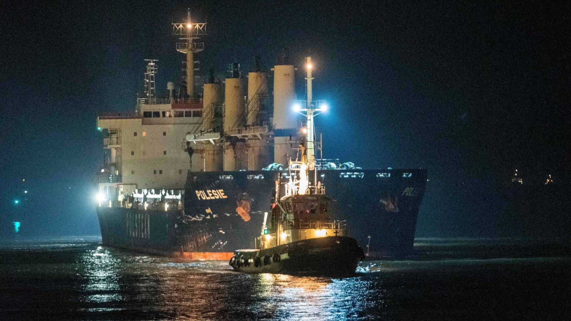 The cargo ship "Polesie" is guided into the harbour of Cuxhaven, northern Germany, on early October 25, 2023, after it collided with another cargo ship, the "Verity", in the North Sea near the Heloland island, on October 24, 2023. | Photo: Rene Schroder/AFP/Ritzau Scanpix