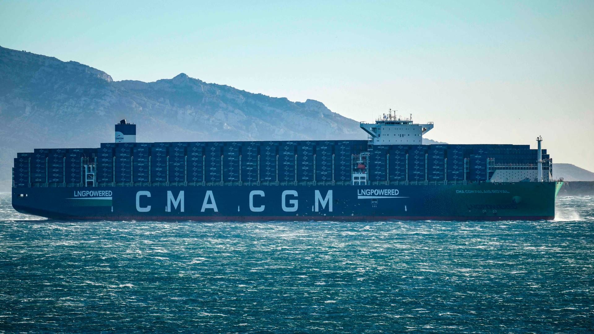 The CMA CGM Palais Royal, the world's largest container ship powered by natural gas, sails in the Bay of Marseille in the south of France on Dec. 14, 2023. CMA CGM announced on Dec.16, 2023, that it, like Maersk and Hapag-Lloyd, will suspend sailings in the Red Sea following attacks on ships by Yemen's Houthi rebels. | Photo: Christophe Simon
