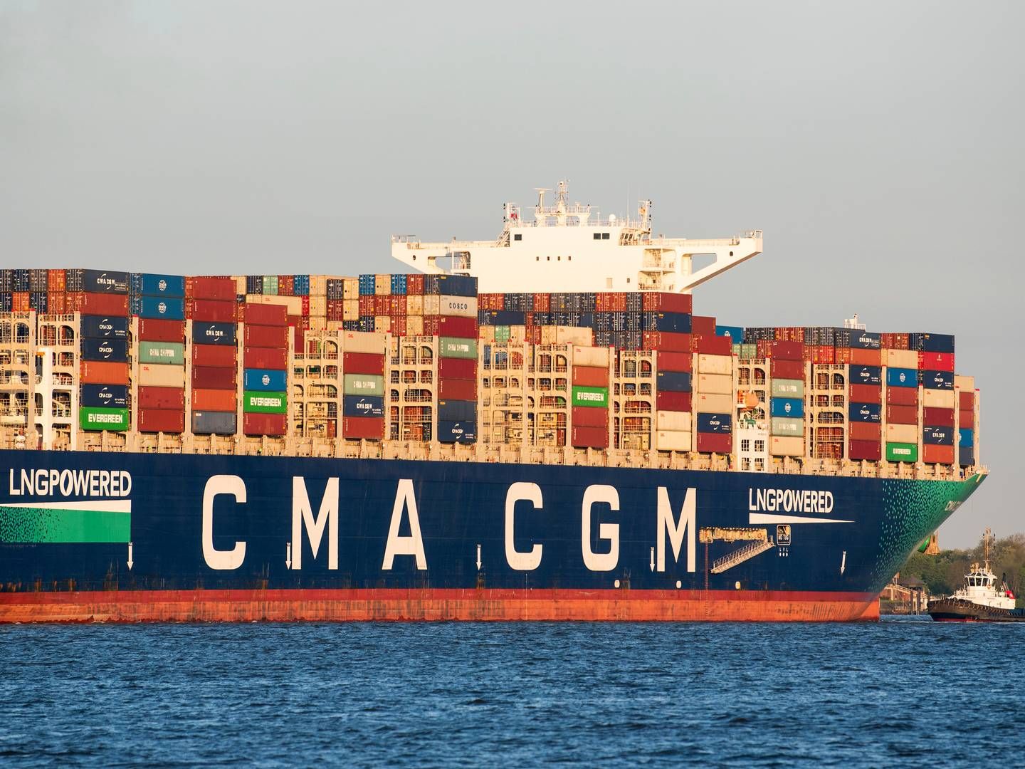 A CMA CGM container ship leaves port terminal - is not the actual ship CMA CGM Tage.