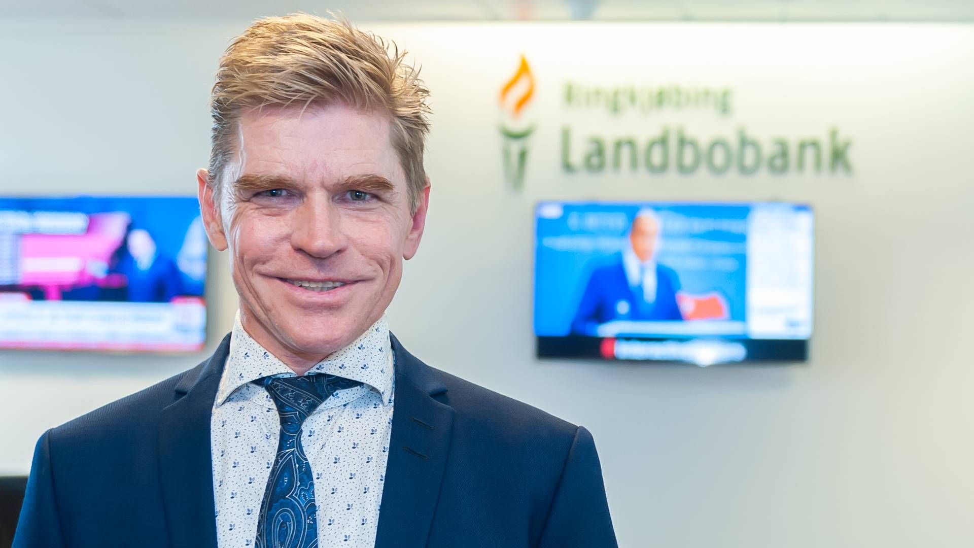 "Hvis ikke der var en fordel i det for kunderne, ville de ikke vælge os," siger John Fisker, adm. direktør i Ringkjøbing Landbobank. | Foto: Ringkøbing Landbobank/pr