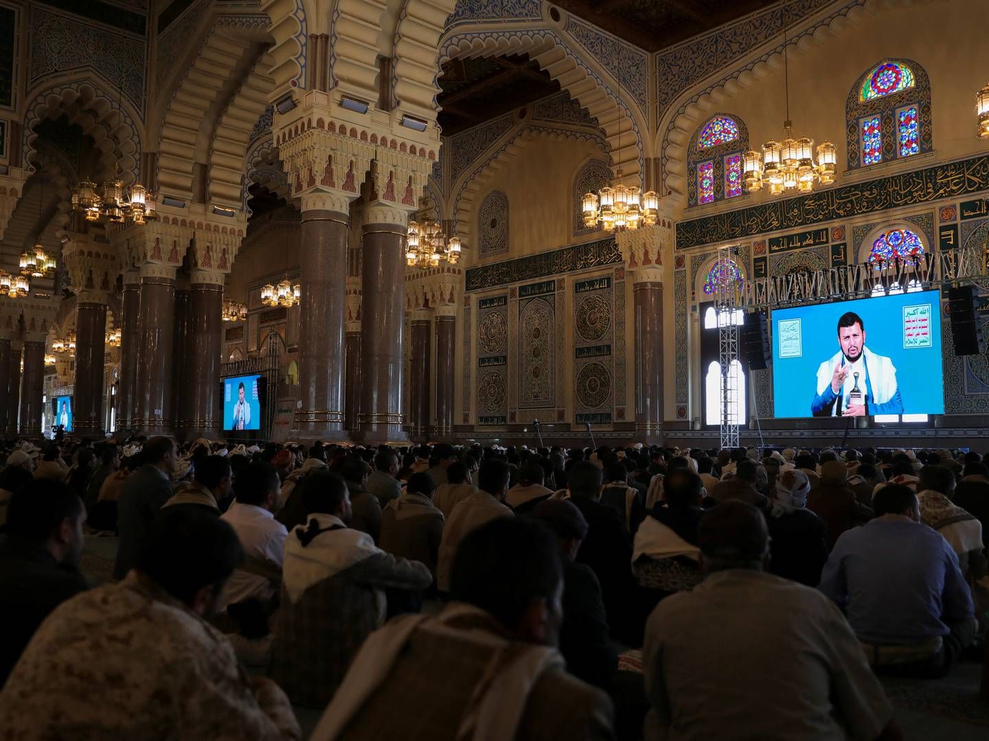 Houthi leader Abdul-Malik al-Houthi speaks to supporters via a TV link ahead of the fasting month of Ramadan at a mosque in Sanaa, Yemen, March 10, 2024, and the rebel movement threatens more attacks on Red Sea merchant ships.