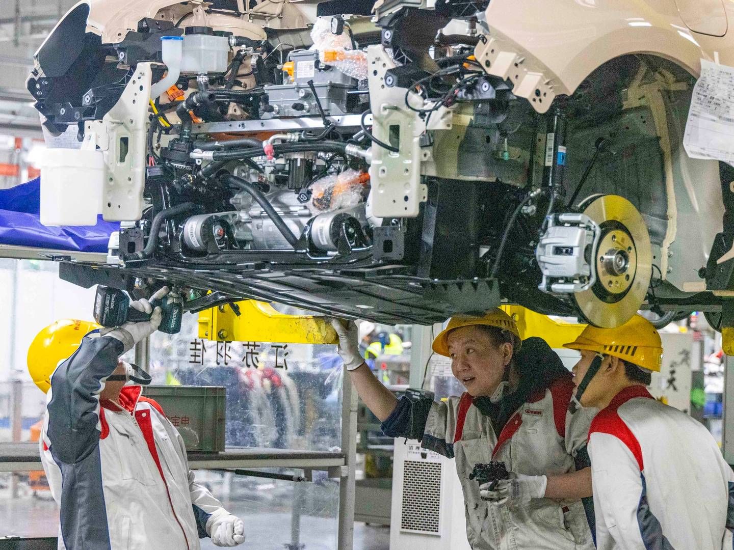 Bilproducenterne skulle bl.a. ønske en 25 pct. told på biler med store motorer produceret i EU. | Foto: Tang Dehong/AP/Ritzau Scanpix
