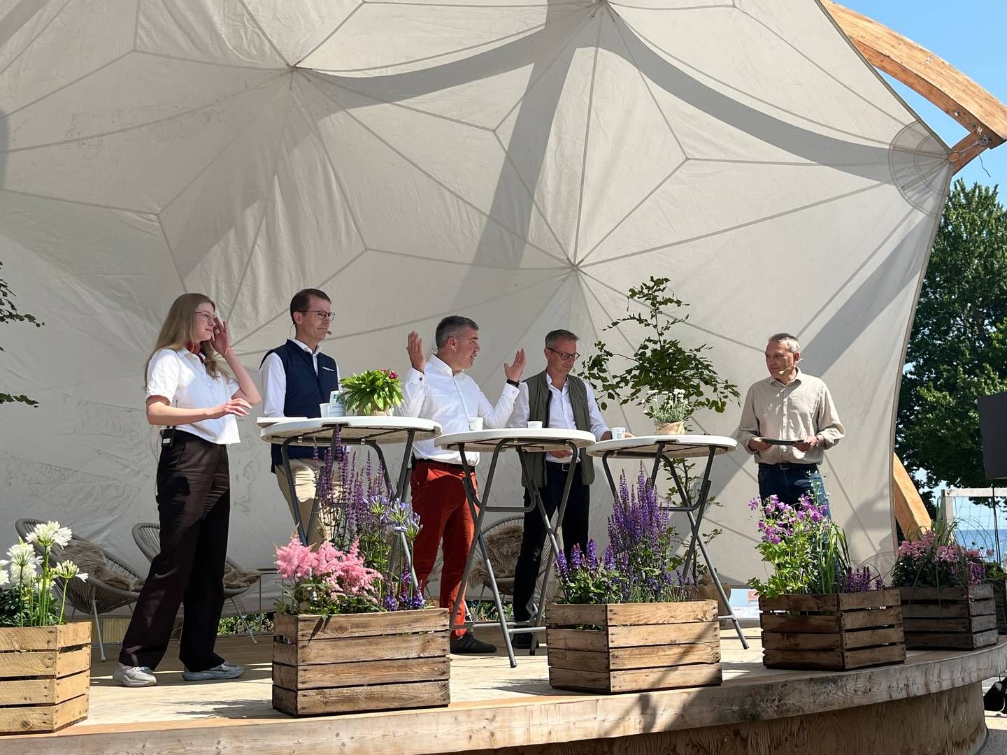 Danish Energy Minister Lars Aagaard and Kristian Jensen from Green Power Denmark on stage at Folkemødet 2025. The picture is from the opening debate on the climate and energy stage. Also present were Claus M. Andersen, CEO of Bornholms Energi and Nadia Gullestrup, co-founder of Gaia. | Photo: Laura Kold