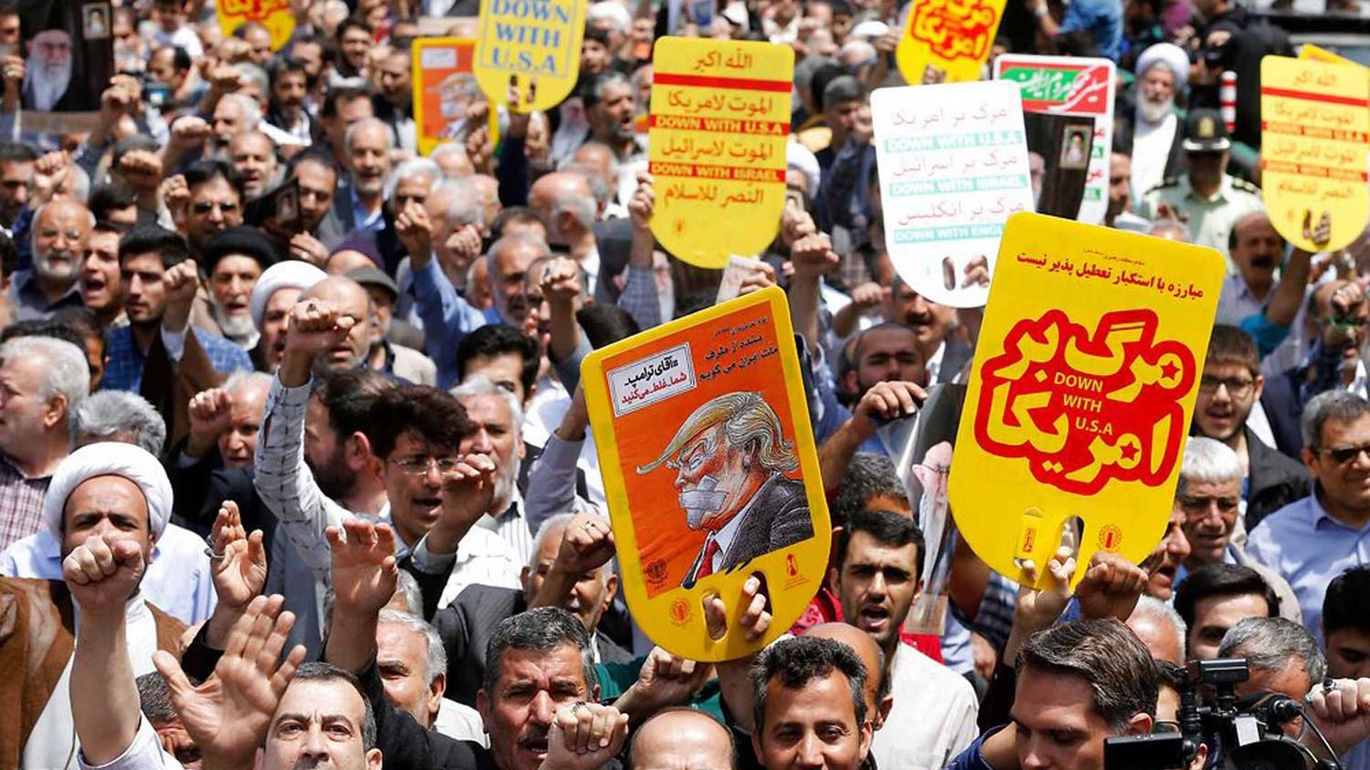 Iranere demonsterede fredag efter den amerikanske præsident Trumps beslutning om at trække landet ud af atomaftalen med Iran og indføre nye sanktioner. | Foto: /Ritzau Scanpix/AFP/STR