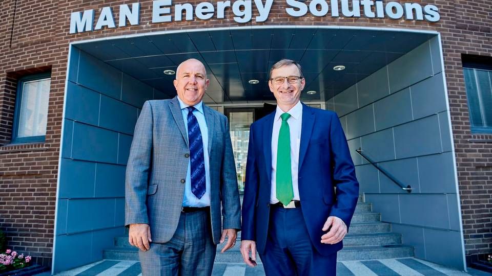 Wayne Jones, CSO and member of the Man Energy Solutions Executive Board, and Thomas S. Knudsen, Senior VP and Head of Two Stroke, reveal the company's new name. | Photo: Foto: MAN Energy Solutions