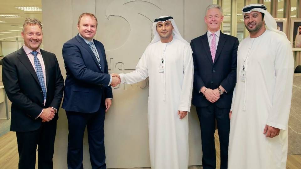 V.Group and Adnoc's managements sealing the deal. | Photo: V.Group