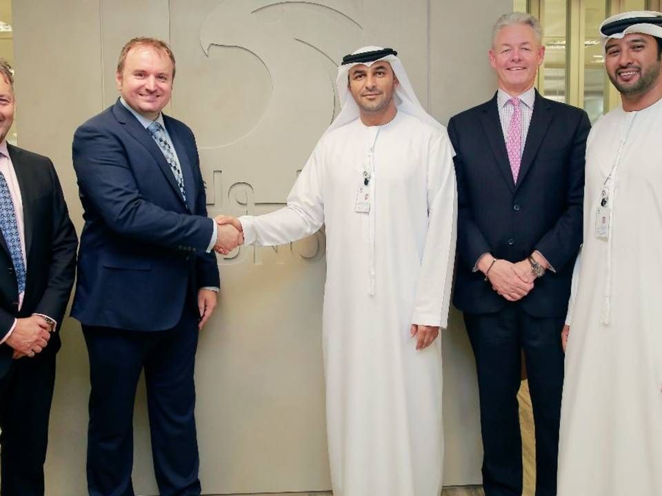 V.Group and Adnoc's managements sealing the deal. | Photo: V.Group