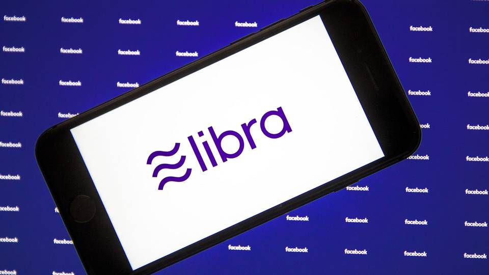 Illustration eines Smartphones mit dem Libra-Logo auf dem Display. | Foto: Picture-Alliance / AA
