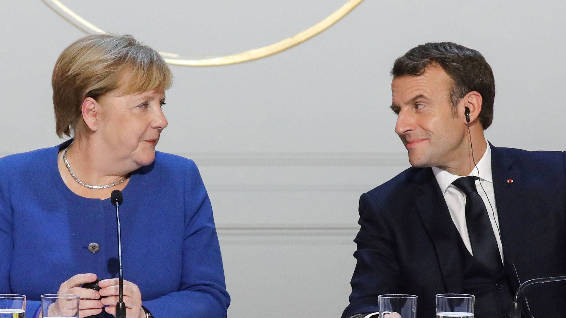 Frankrigs præsident, Emmanuel Macron (th), og den tyske forbundskansler, Angela Merkel (tv). | Foto: Pool New/Reuters/Ritzau Scanpix