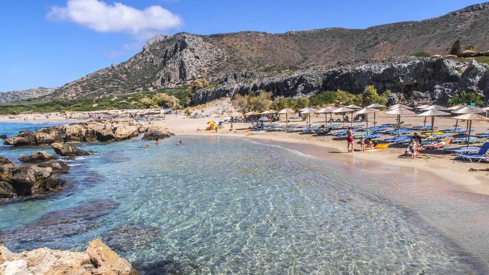 Kanskje kan nordmenn fra 15. juli kose seg på stranden ved Falasserna på Kreta i Hellas, men forsikringsselskapene ber kundene vente med å bestille tur. | Foto: Halvard Alvik/NTB Scanpix