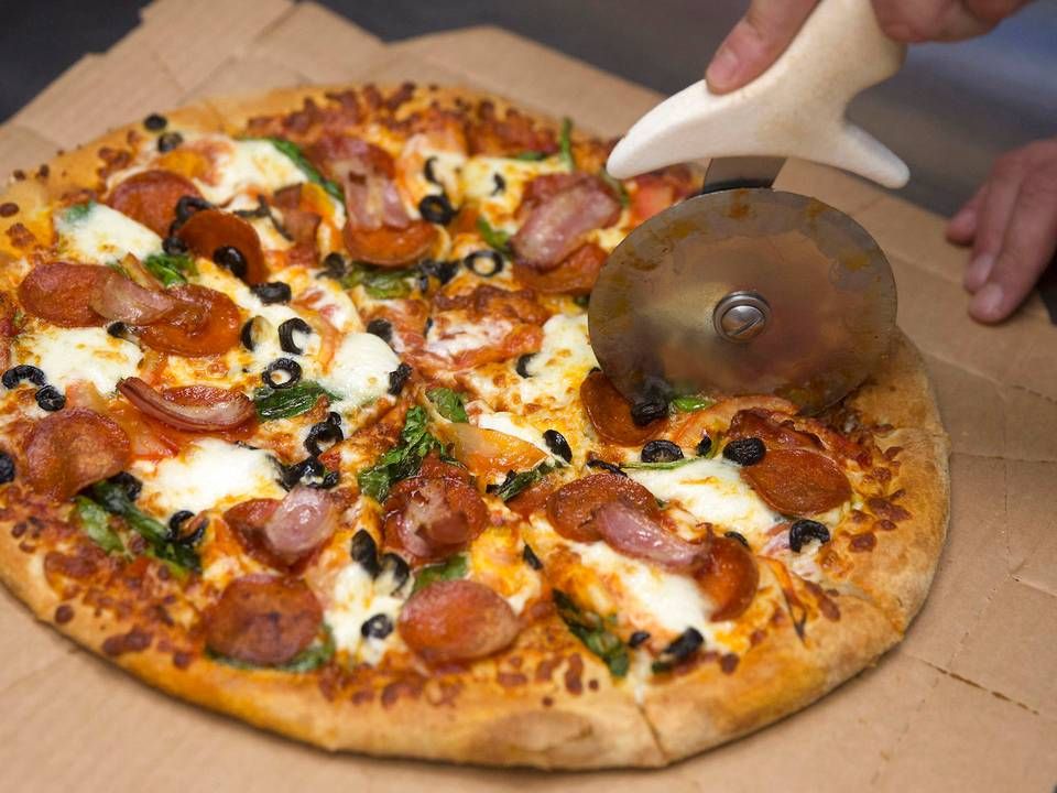 Dominos forsøger at lokke kunder til med tilbud til pizza for 40 kr. stykket. | Foto: Thomas Peter/Reuters/Ritzau Scanpix