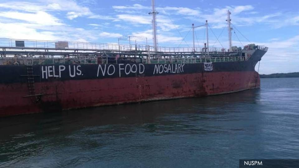Stranded seafarers on board tanker ship Viet Tin 01 have written the words "Help us. No food. No salary" on the side of the ship, which is photographed in Malaysia. | Photo: NUSPM