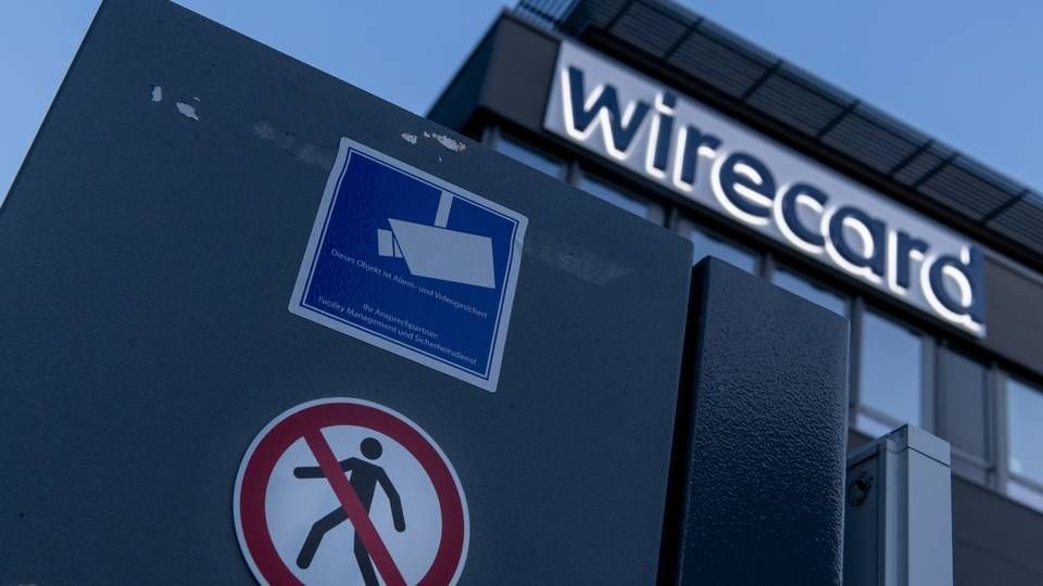 Der Schriftzug von Wirecard ist an der Firmenzentrale des Zahlungsdienstleisters in Aschbeim bei München zu sehen. | Foto: picture alliance/Peter Kneffel/dpa