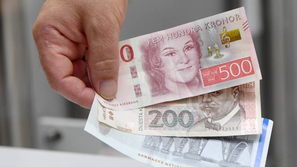 Scheine verschiedener europäischer Währungen, (von oben) schwedische Kronen, kroatische Kuna und dänische Kronen | Foto: picture alliance / Tobias Hase/dpa