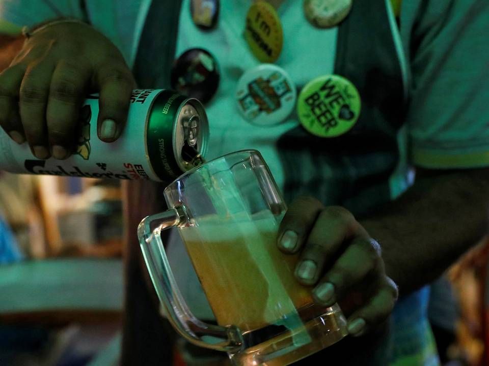 Carlsberg og bryggeriets parner i Indien er røget alvorligt i infight om millioner af kroner. | Foto: Danish Siddiqui/Reuters/Ritzau Scanpix