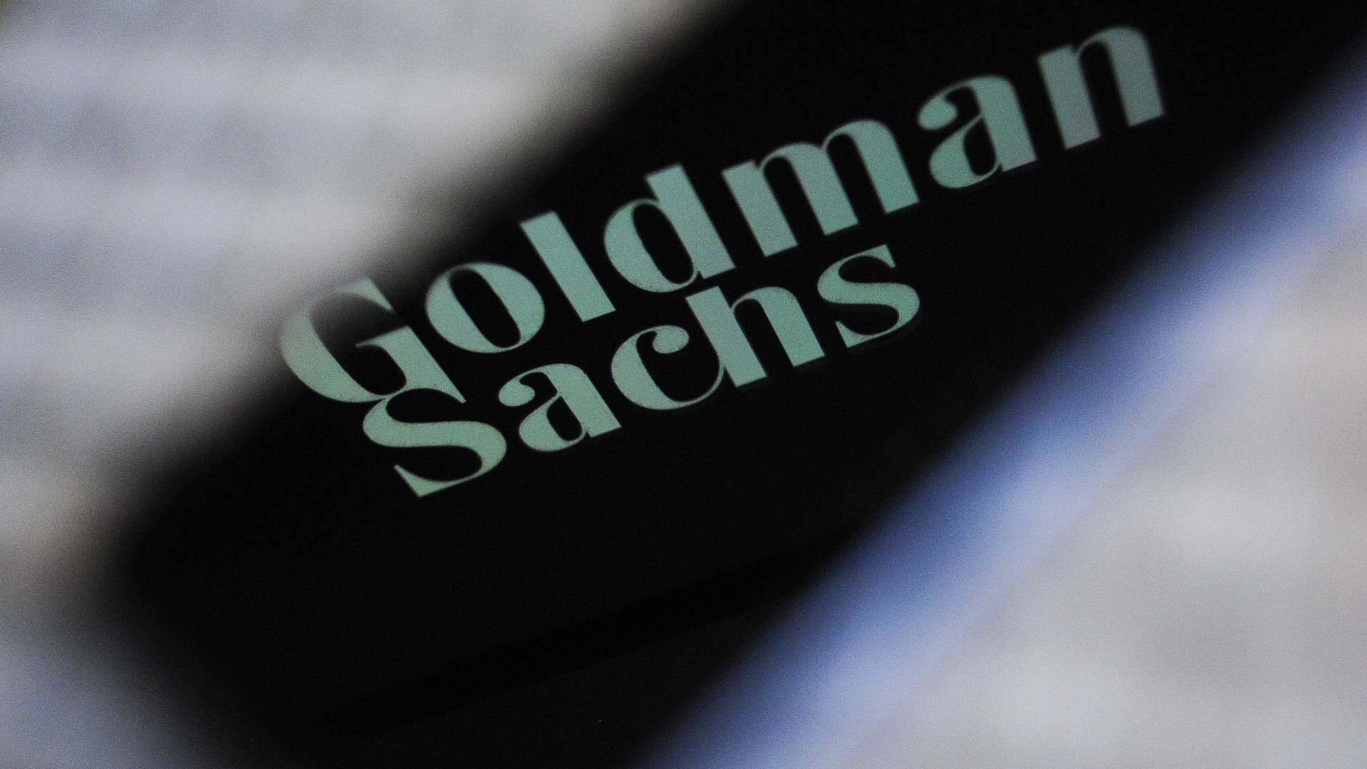 Goldman- Sachs-Logo, reflektiert auf dem Bildschirm eines Smartphones | Foto: picture alliance / NurPhoto | Jaap Arriens