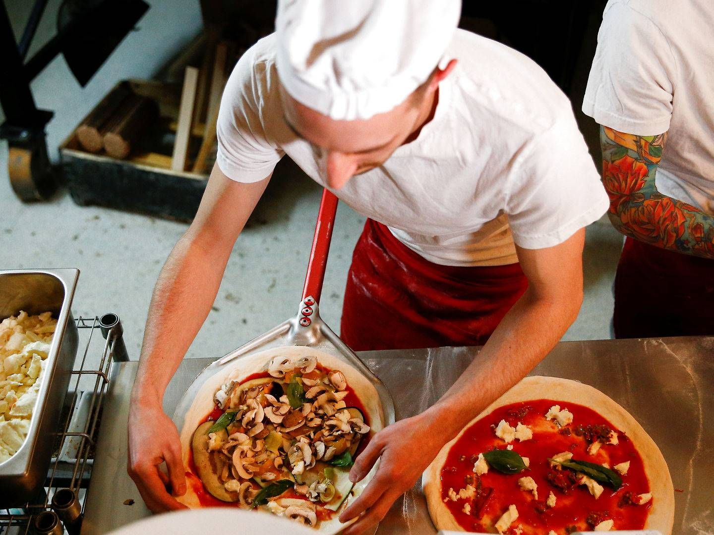 Dansk pizzatopping til de britiske pizzabagere, lyder forhåbningerne fra Danish Crown Foods til genåbningerne. | Foto: Henry Nicholls/Reuters/Ritzau Scanpix