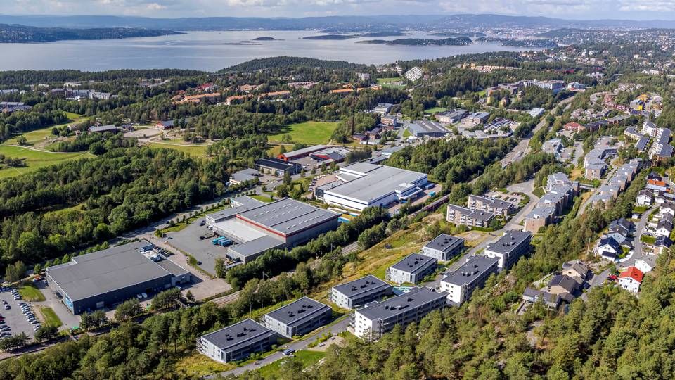 FRA INDUSTRI TIL BOLIG: Det gamle industriområdet på Rosenholm skal bli en ny OBOS-bydel med nærmere 2000 bolige | Foto: Nyebilder.no