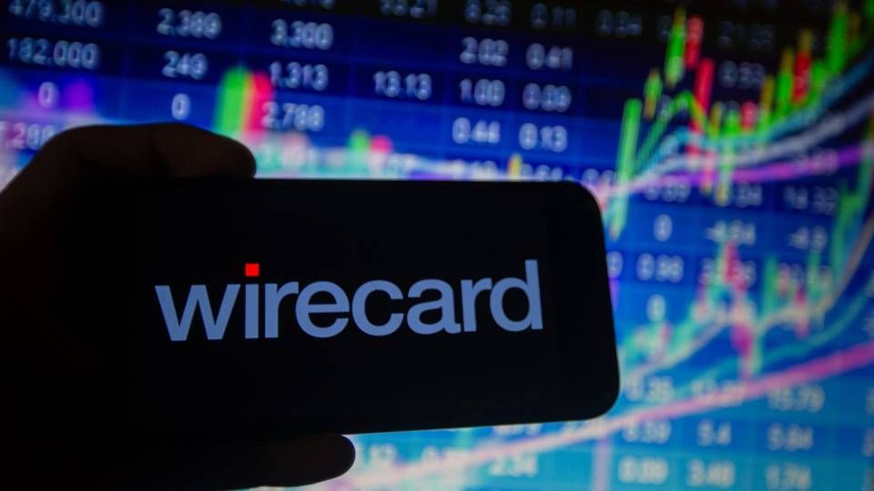 Es war einmal: Wirecard-Logo vor einem DAX-Bildschirm 2018 | Foto: picture alliance / NurPhoto | Alexander Pohl
