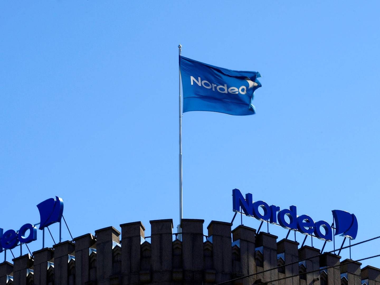The Nordea bank flag flutters over the banks branch in Helsinki. | Photo: Ints Kalnins/Reuters/Ritzau Scanpix