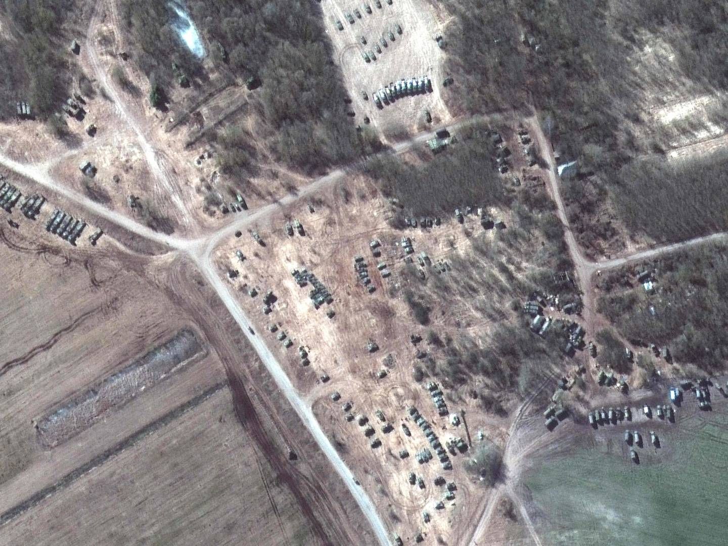 This handout satellite image released by Maxar Technologies shows troop tents and equipment from Russian ground forces in Dublin, a village in the Gomel region of Belarus, on March 18, 2022. | Photo: AFP/Ritzau Scanpix