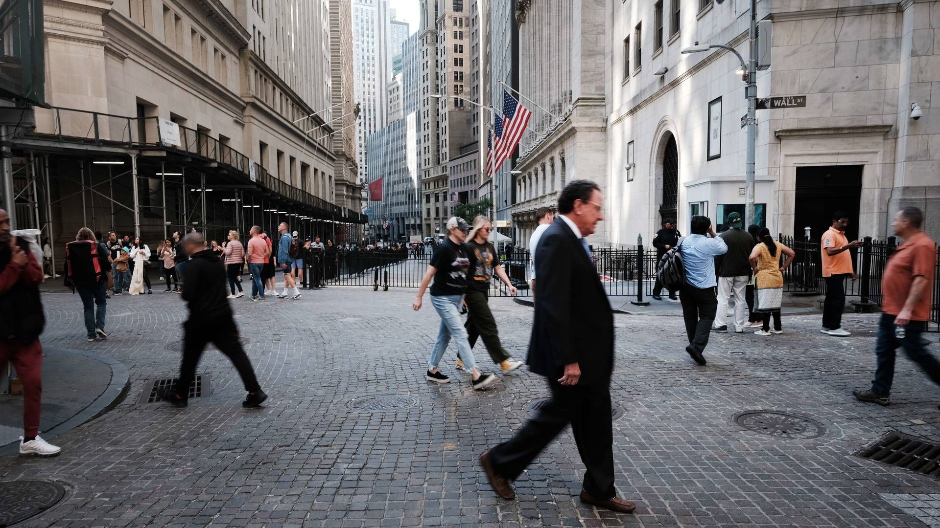 Pedestrians on Wall Street, New York. | Photo: Spencer Platt / AFP / Getty Images / Ritzau Scanpix